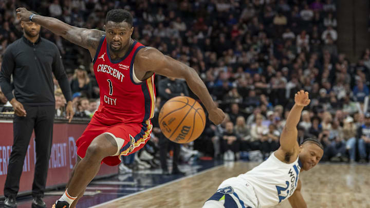 Mar 19, 2025; Minneapolis, Minnesota, USA; New Orleans Pelicans forward Zion Williamson (1) and Minnesota Timberwolves guard Jaylen Clark (22) attempt to go after a loose ball in the second half at Target Center. Mandatory Credit: Jesse Johnson-Imagn Images