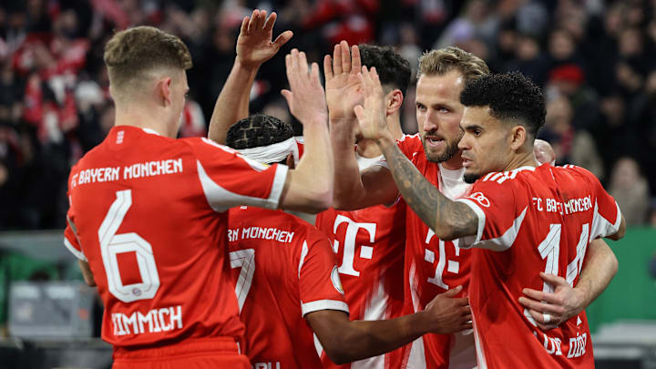 Bayern Munich players celebrating a goal against RB Leipzig in DFB Pokal quarter-finals.