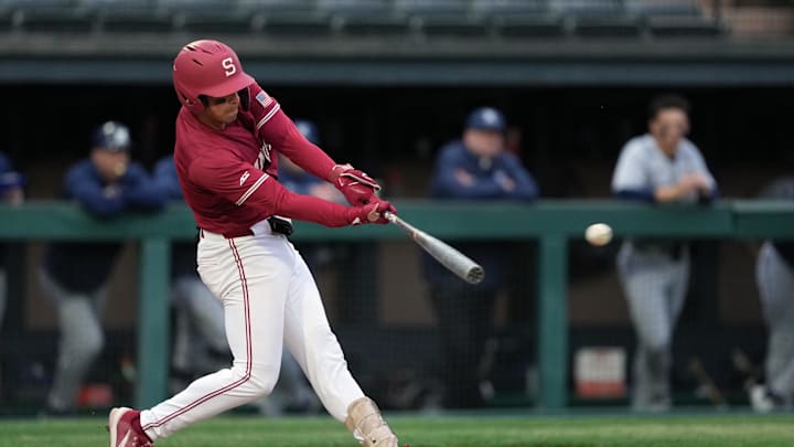 Mar 1, 2025; Stanford, CA, USA; Stanford Cardinal second baseman Jimmy Nati (6) hits an RBI double against the Xavier Musketeers during the third inning at Sunken Diamond. Mandatory Credit: Darren Yamashita-Imagn Images
