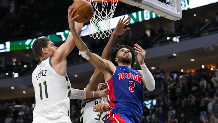 Nov 13, 2024; Milwaukee, Wisconsin, USA; Detroit Pistons guard Cade Cunningham (2) shoots against Milwaukee Bucks center Brook Lopez (11) and forward Giannis Antetokounmpo (34) during the fourth quarter at Fiserv Forum. Mandatory Credit: Jeff Hanisch-Imagn Images Nov 13, 2024; Milwaukee, Wisconsin, USA; Detroit Pistons guard Cade Cunningham (2) shoots against Milwaukee Bucks center Brook Lopez (11) and forward Giannis Antetokounmpo (34) during the fourth quarter at Fiserv Forum. Mandatory Credit: Jeff Hanisch-Imagn Images