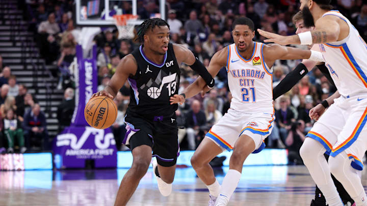 Feb 21, 2025; Salt Lake City, Utah, USA; Utah Jazz guard Isaiah Collier (13) drives against Oklahoma City Thunder guard Aaron Wiggins (21) during the second half at Delta Center. Mandatory Credit: Rob Gray-Imagn Images Feb 21, 2025; Salt Lake City, Utah, USA; Utah Jazz guard Isaiah Collier (13) drives against Oklahoma City Thunder guard Aaron Wiggins (21) during the second half at Delta Center. Mandatory Credit: Rob Gray-Imagn Images