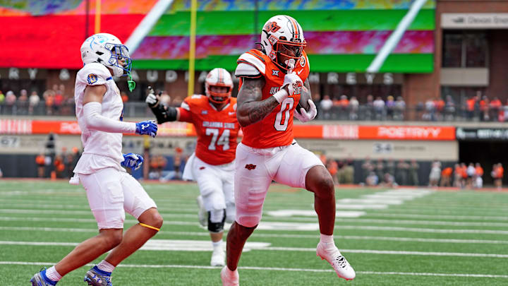 Oklahoma State's Ollie Gordon II (0) scores a touchdown in the first half of the college football game between the Oklahoma State Cowboys and South Dakota State Jackrabbits at Boone Pickens Stadium in Stillwater, Okla., Saturday, Aug., 31, 2024. Oklahoma State's Ollie Gordon II (0) scores a touchdown in the first half of the college football game between the Oklahoma State Cowboys and South Dakota State Jackrabbits at Boone Pickens Stadium in Stillwater, Okla., Saturday, Aug., 31, 2024.