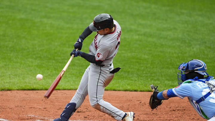 Cleveland Guardians left fielder Steven Kwan (38) hits a single during the third inning against the Kansas City Royals at Kauffman Stadium on March 30.