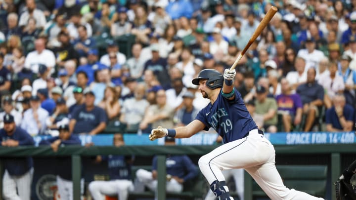 Seattle Mariners catcher Cal Raleigh (29) hits a single against the Detroit Tigers during the fourth inning at T-Mobile Park on Aug 8. Seattle Mariners catcher Cal Raleigh (29) hits a single against the Detroit Tigers during the fourth inning at T-Mobile Park on Aug 8.