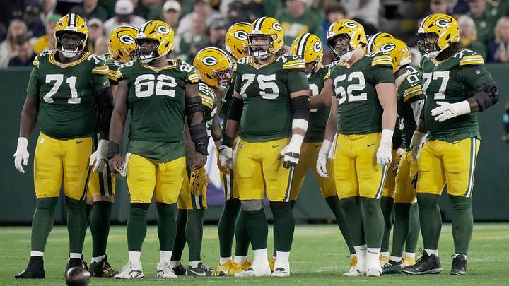 Green Bay Packers offensive tackle Anthony Belton (71), center Jacob Monk (62), guard Sean Rhyan (75), Jacob Monk (62) and guard Jordan Morgan (77) are shown during the first quarter of their game against the Atlanta Falcons Thursday, Sept. 24, 2026 at Lambeau Field in Green Bay, Wisconsin.