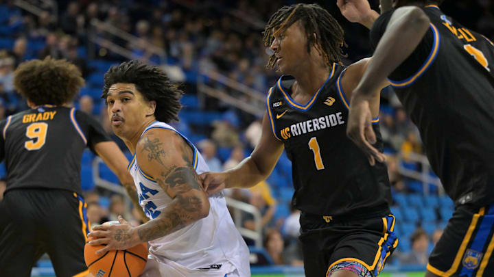 Dec 23, 2025; Los Angeles, California, USA; UCLA Bruins guard Skyy Clark (55) is defended by UC Riverside Highlanders guard De'Undrae Perteete Jr. (1) as he drives to the basket in the first half at Pauley Pavilion presented by Wescom Financial. Mandatory Credit: Jayne Kamin-Oncea-Imagn Images