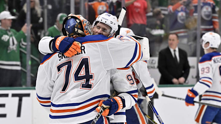 Edmonton Oilers goaltender Stuart Skinner (74) reacts with right wing Corey Perry (90) after defeating the Dallas Stars in game five of the Western Conference Final