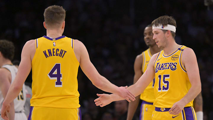 Mar 19, 2025; Los Angeles, California, USA; Los Angeles Lakers guard Dalton Knecht (4) and guard Austin Reaves (15) on the court in the first half against the Denver Nuggets at Crypto.com Arena. Mandatory Credit: Jayne Kamin-Oncea-Imagn Images