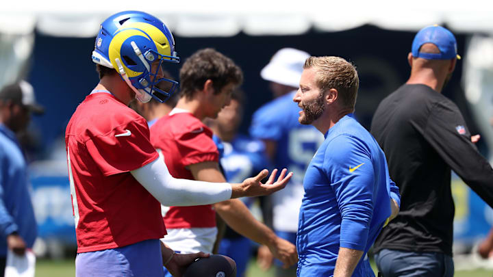 Jul 31, 2024; Los Angeles, CA, USA;  Los Angeles Rams quarterback Matthew Stafford (9) and head coach Sean McVay talk during training camp at Loyola Marymount University. Mandatory Credit: Kiyoshi Mio-Imagn Images