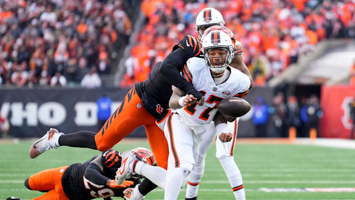 Cleveland Browns quarterback Dorian Thompson-Robinson (17) fumbles the ball as he is wrapped up by Cincinnati Bengals defensive end Joseph Ossai (58) in the fourth quarter of the NFL Week 16 game between the Cincinnati Bengals and the Cleveland Browns. Cleveland Browns quarterback Dorian Thompson-Robinson (17) fumbles the ball as he is wrapped up by Cincinnati Bengals defensive end Joseph Ossai (58) in the fourth quarter of the NFL Week 16 game between the Cincinnati Bengals and the Cleveland Browns.