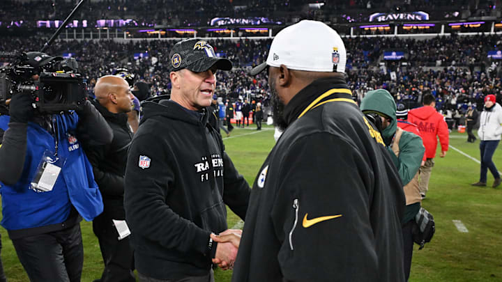 Jan 11, 2025; Baltimore, Maryland, USA; Baltimore Ravens head coach John Harbaugh shakes hands with Pittsburgh Steelers head coach Mike Tomlin after an AFC wild card game at M&T Bank Stadium. Mandatory Credit: Tommy Gilligan-Imagn Images