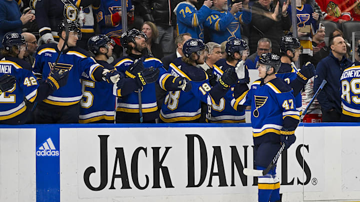 Apr 10, 2024; St. Louis, Missouri, USA;  St. Louis Blues defenseman Torey Krug (47) is congratulated by teammates after scoring against the Chicago Blackhawks during the first period at Enterprise Center. Mandatory Credit: Jeff Curry-Imagn Images