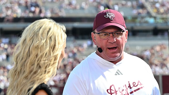 Oct 5, 2024; College Station, Texas, USA; SEC Nation host Laura speaks with Texas A&M Aggies head coach Mike Elko prior to the game between the Texas A&M Aggies and the Missouri Tigers at Kyle Field. Mandatory Credit: Maria Lysaker-Imagn Images. 