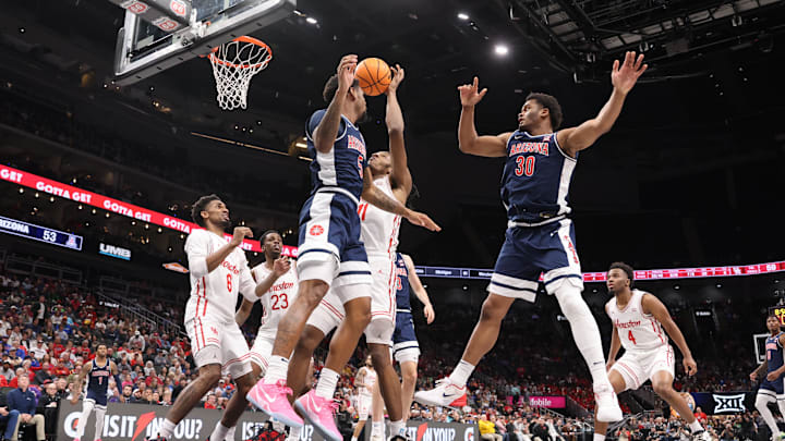 Mar 15, 2025; Kansas City, MO, USA; Arizona Wildcats guard KJ Lewis (5), forward Tobe Awaka (30) attempt to grab a rebound against Houston Cougars forward Joseph Tugler (11) during the second half for the Big 12 Conference Tournament Championship game at T-Mobile Center. Mandatory Credit: William Purnell-Imagn Images Mar 15, 2025; Kansas City, MO, USA; Arizona Wildcats guard KJ Lewis (5), forward Tobe Awaka (30) attempt to grab a rebound against Houston Cougars forward Joseph Tugler (11) during the second half for the Big 12 Conference Tournament Championship game at T-Mobile Center. Mandatory Credit: William Purnell-Imagn Images