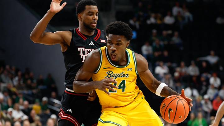 Jan 20, 2026; Waco, Texas, USA; Baylor Bears guard Tounde Yessoufou (24) controls the ball as Texas Tech Red Raiders forward Donovan Atwell (12) defends during the first half at Paul and Alejandra Foster Pavilion. Jan 20, 2026; Waco, Texas, USA; Baylor Bears guard Tounde Yessoufou (24) controls the ball as Texas Tech Red Raiders forward Donovan Atwell (12) defends during the first half at Paul and Alejandra Foster Pavilion.