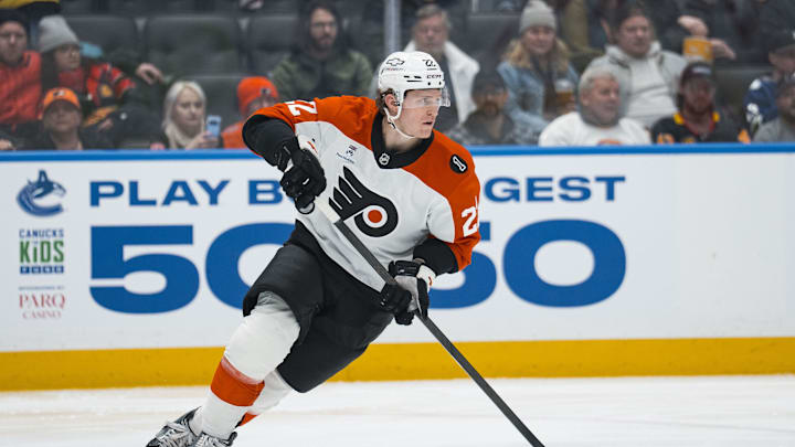 Dec 30, 2025; Vancouver, British Columbia, CAN; Philadelphia Flyers forward Christian Dvorak (22) handles the puck against the Vancouver Canucks in the second period at Rogers Arena. Mandatory Credit: Bob Frid-Imagn Images