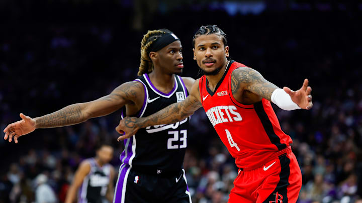 Jan 16, 2025; Sacramento, California, USA; Houston Rockets guard Jalen Green (4) is defended by Sacramento Kings guard Keon Ellis (23) during the second quarter at Golden 1 Center. Mandatory Credit: Sergio Estrada-Imagn Images