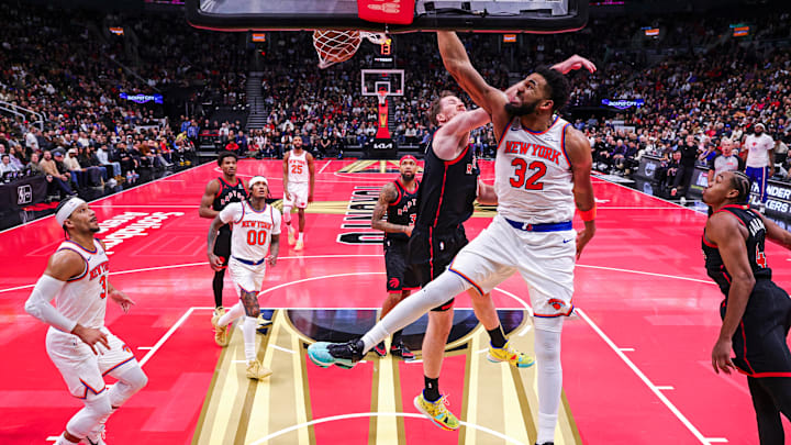Karl-Anthony Towns drives past Jakob Poeltl 
