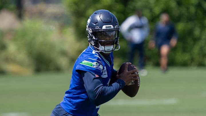 Seattle Seahawks quarterback Jalen Milroe scrambles during mini-camp at Virginia Mason Athletic Center