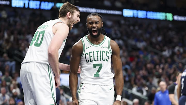 Jaylen Brown, right,  celebrates with Celtics center Luke Kornet 