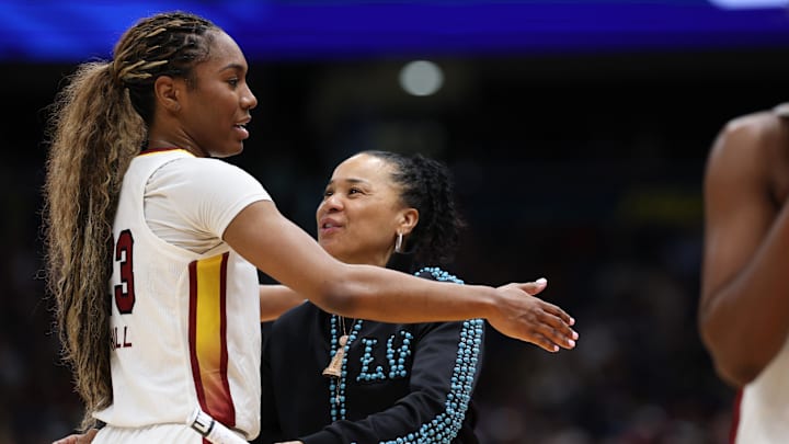 Apr 6, 2025; Tampa, FL, USA; South Carolina Gamecocks head coach Dawn Staley hugs guard Bree Hall (23) during the second half of the national championship of the women's 2025 NCAA tournament at Amalie Arena. Mandatory Credit: Nathan Ray Seebeck-Imagn Images Apr 6, 2025; Tampa, FL, USA; South Carolina Gamecocks head coach Dawn Staley hugs guard Bree Hall (23) during the second half of the national championship of the women's 2025 NCAA tournament at Amalie Arena. Mandatory Credit: Nathan Ray Seebeck-Imagn Images