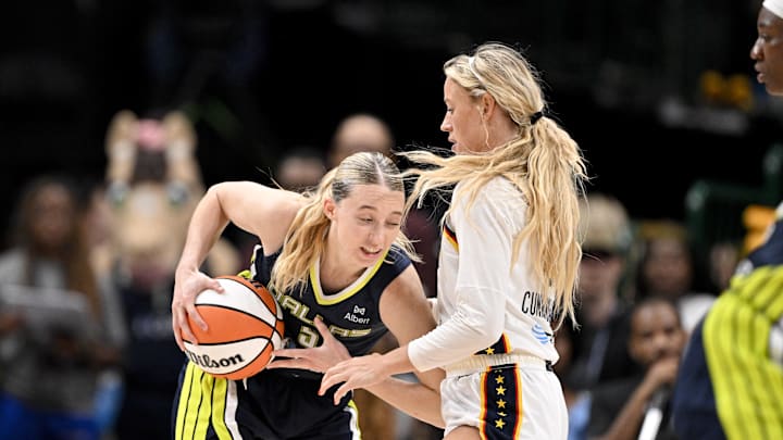 Aug 1, 2025; Dallas, Texas, USA;  Dallas Wings guard Paige Bueckers (5) collides with Indiana Fever guard Sophie Cunningham (8) during the second half at the American Airlines Center. Mandatory Credit: Jerome Miron-Imagn Images