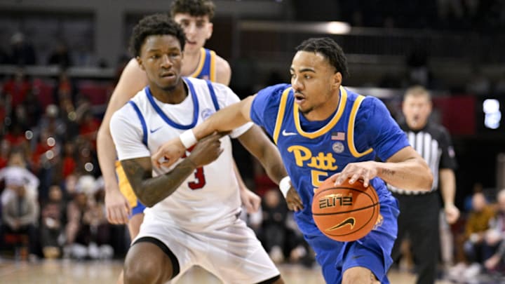 Feb 11, 2025; Dallas, Texas, USA; Pittsburgh Panthers guard Ishmael Leggett (5) drives to the basket past Southern Methodist Mustangs guard Chuck Harris (3) during the first half at Moody Coliseum. Mandatory Credit: Jerome Miron-Imagn Images