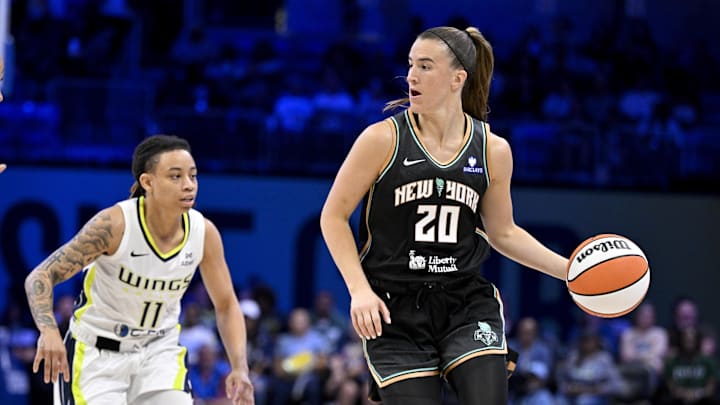 Jul 28, 2025; Arlington, Texas, USA; New York Liberty guard Sabrina Ionescu (20) brings the ball up court past Dallas Wings guard JJ Quinerly (11) during the second half at College Park Center. Mandatory Credit: Jerome Miron-Imagn Images
