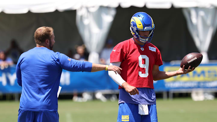 Jul 31, 2024; Los Angeles, CA, USA;  Los Angeles Rams head coach Sean McVay talks to quarterback Matthew Stafford (9) in jog through during training camp at Loyola Marymount University. Mandatory Credit: Kiyoshi Mio-Imagn Images