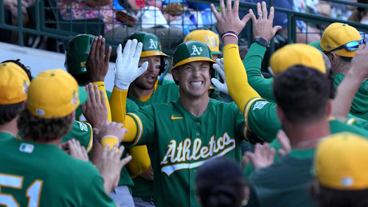 Mar 7, 2026; Mesa, Arizona, USA; Athletics catcher Brian Serven (10) celebrates with teammates after hitting a two run home run against the Chicago Cubs in the third inning at Sloan Park. Mandatory Credit: Rick Scuteri-Imagn Images