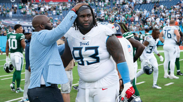 General Manager Ran Carthon greets Tennessee Titans defensive tackle T'Vondre Sweat