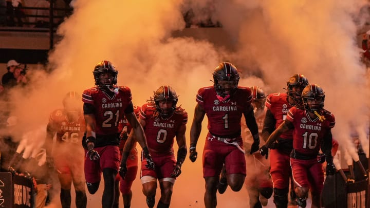 Nov 25, 2023; Columbia, South Carolina, USA; South Carolina Gamecocks defensive back Nick Emmanwori (21), linebacker Debo Williams (0), defensive back DQ Smith (1) and wide receiver Ahmarean Brown (10) lead the team onto the field prior to a game against the Clemson Tigers at Williams-Brice Stadium. Mandatory Credit: David Yeazell-USA TODAY Sports