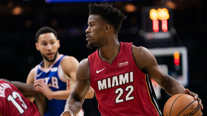 Dec 18, 2019; Philadelphia, PA, USA; Miami Heat forward Jimmy Butler (22) dribbles the ball against Philadelphia 76ers guard Ben Simmons (25) during the first quarter at Wells Fargo Center. Mandatory Credit: Bill Streicher-Imagn Images