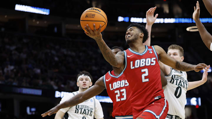 Mar 23, 2025; Cleveland, OH, USA; New Mexico Lobos guard Donovan Dent (2) shoots the ball in the second half against the Michigan State Spartans during the NCAA Tournament Second Round at Rocket Arena. Mandatory Credit: Rick Osentoski-Imagn Images