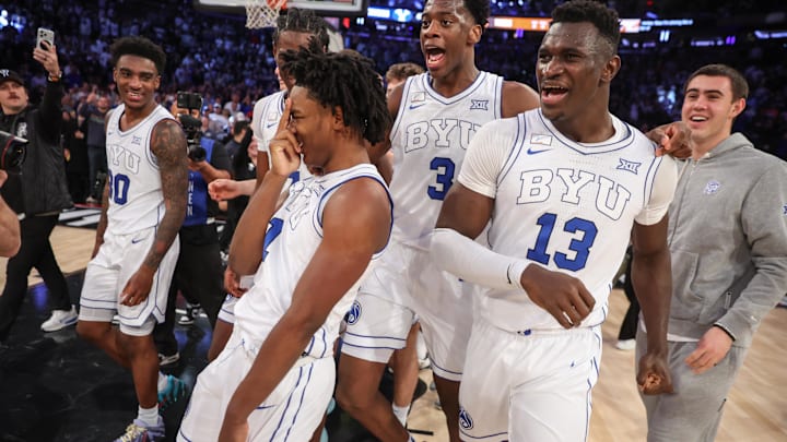 Dec 9, 2025; New York, New York, USA; BYU Cougars guard Robert Wright III (1) celebrates with his teammates after hiting a game winning three point shot to beat the Clemson Tigers 67-64 at Madison Square Garden. Mandatory Credit: Wendell Cruz-Imagn Images Dec 9, 2025; New York, New York, USA; BYU Cougars guard Robert Wright III (1) celebrates with his teammates after hiting a game winning three point shot to beat the Clemson Tigers 67-64 at Madison Square Garden. Mandatory Credit: Wendell Cruz-Imagn Images