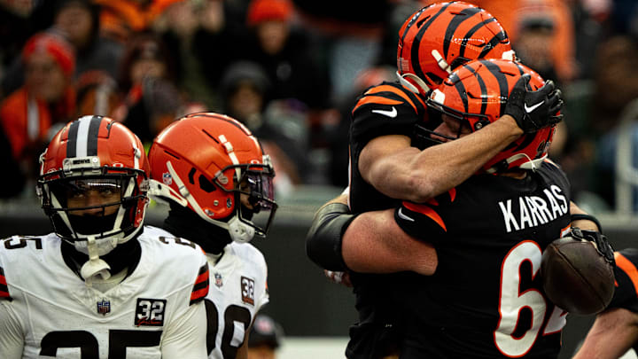 Cincinnati Bengals wide receiver Andrei Iosivas (80) celebrates with Cincinnati Bengals center Ted Karras (64) after scoring a touchdown in the third quarter of the NFL game between Cincinnati Bengals and Cleveland Browns at Paycor Stadium in Cincinnati on Sunday, Jan. 7, 2024. Cincinnati Bengals wide receiver Andrei Iosivas (80) celebrates with Cincinnati Bengals center Ted Karras (64) after scoring a touchdown in the third quarter of the NFL game between Cincinnati Bengals and Cleveland Browns at Paycor Stadium in Cincinnati on Sunday, Jan. 7, 2024.
