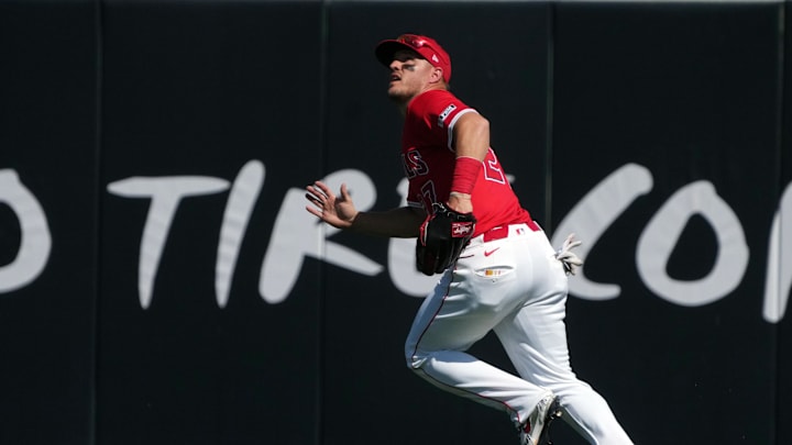 Mar 10, 2025; Tempe, Arizona, USA; Los Angeles Angels outfielder Mike Trout (27) makes the play for an out against the Colorado Rockies  in the fourth inning at Tempe Diablo Stadium. Mandatory Credit: Rick Scuteri-Imagn Images