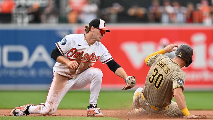 Jun 14, 2026; Baltimore, Maryland, USA;  Baltimore Orioles infielder Gunnar Henderson (2) tags San Diego Padres infielder Gavin Sheets (30) out at second base to complete a double play in the sixth inning at Oriole Park at Camden Yards. Mandatory Credit: Jamie Sabau-Imagn Images