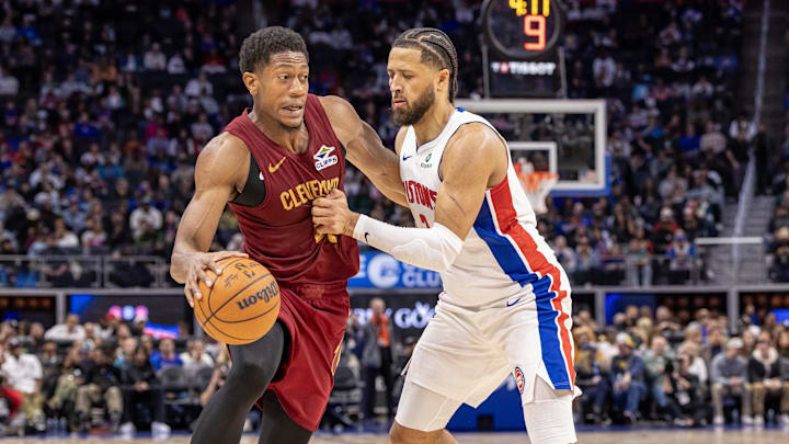 Oct 27, 2025; Detroit, Michigan, USA; Detroit Pistons guard Cade Cunningham (2) defends against Cleveland Cavaliers forward De'Andre Hunter (12) during the second half at Little Caesars Arena. Mandatory Credit: David Reginek-Imagn Images