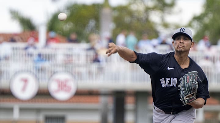 Feb 25, 2025; Fort Myers, Florida, USA; New York Yankees pitcher Carlos Carrasco (59) pitches against the Minnesota Twins in the second inning at Lee Health Sports Complex.