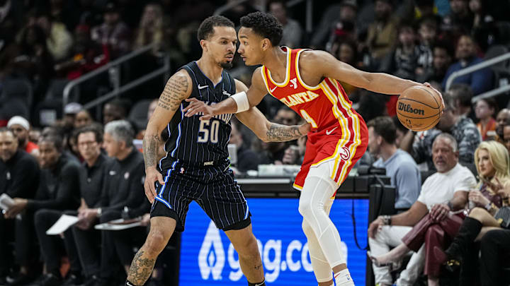 Feb 25, 2024; Atlanta, Georgia, USA; Atlanta Hawks guard Kobe Bufkin (4) is guarded by Orlando Magic