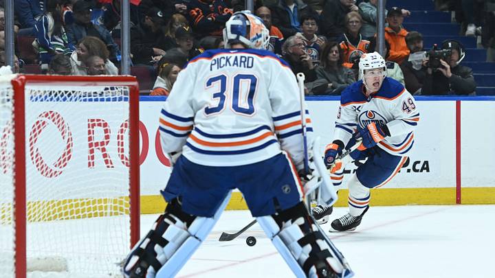 Oct 26, 2025; Vancouver, British Columbia, CAN; Edmonton Oilers defenseman Ty Emberson (49) skates with the puck passed goaltender Calvin Pickard (30) during the second period against the Vancouver Canucks at Rogers Arena. Mandatory Credit: Simon Fearn-Imagn Images Oct 26, 2025; Vancouver, British Columbia, CAN; Edmonton Oilers defenseman Ty Emberson (49) skates with the puck passed goaltender Calvin Pickard (30) during the second period against the Vancouver Canucks at Rogers Arena. Mandatory Credit: Simon Fearn-Imagn Images