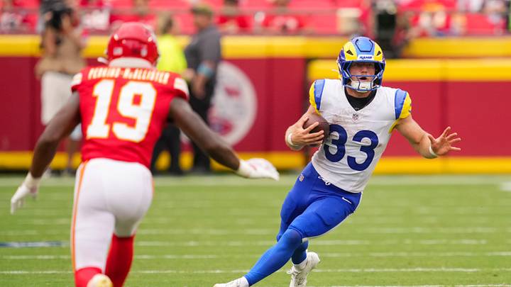 Aug 15, 2026; Kansas City, Missouri, USA; Los Angeles Rams running back Dean Connors (33) runs with the ball against Kansas City Chiefs cornerback D'Arco Perkins-McAllister (19) during the second half at at Arrowhead Stadium. Mandatory Credit: Jay Biggerstaff-Imagn Images Aug 15, 2026; Kansas City, Missouri, USA; Los Angeles Rams running back Dean Connors (33) runs with the ball against Kansas City Chiefs cornerback D'Arco Perkins-McAllister (19) during the second half at at Arrowhead Stadium. Mandatory Credit: Jay Biggerstaff-Imagn Images