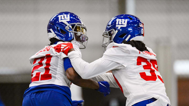 Jun 18, 2025; East Rutherford, NJ, USA; New York Giants cornerback Paulson Adebo (21) and cornerback O'Donnell Fortune (39) participate in a drill during minicamp at Quest Diagnostics Training Center.  