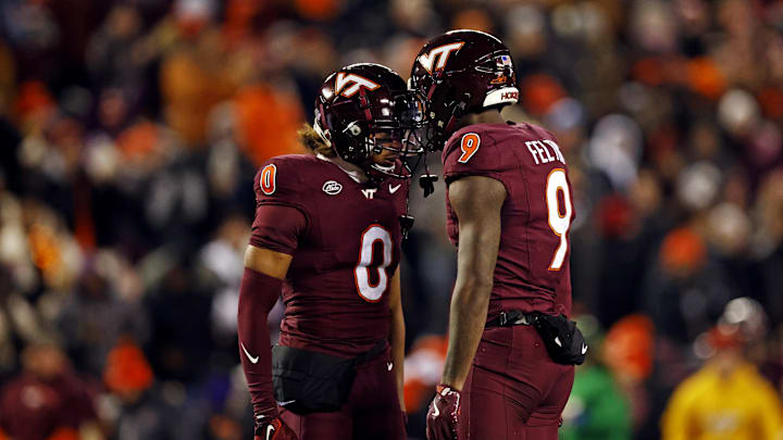 Nov 30, 2024; Blacksburg, Virginia, USA; Virginia Tech Hokies wide receiver Da'Quan Felton (9) celebrates with wide receiver Ali Jennings (0) after making a long catch during the first quarter against the Virginia Cavaliers at Lane Stadium. Mandatory Credit: Peter Casey-Imagn Images