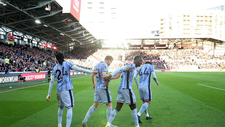 Spurs players celebrate after Pape Sarr made sure of the points