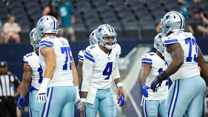 Aug 12, 2023; Arlington, Texas, USA;  Dallas Cowboys quarterback Dak Prescott (4) greets teammates