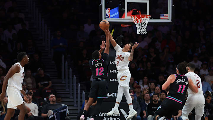 Nov 12, 2025; Miami, Florida, USA; Cleveland Cavaliers guard Craig Porter Jr. (9) block a shot against Miami Heat guard Dru Smith (12) during the second quarter at Kaseya Center. Mandatory Credit: Sam Navarro-Imagn Images