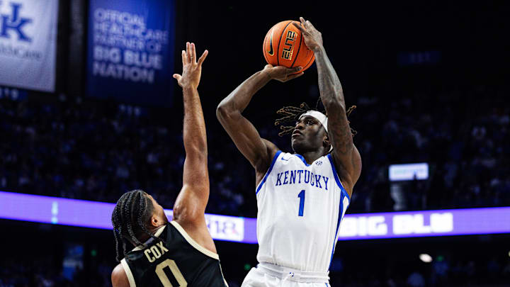 Oct 24, 2025; Lexington, KY, USA; Kentucky Wildcats guard Denzel Aberdeen (1) shoots the ball against Purdue Boilermakers guard C.J. Cox (0) during the second half at Rupp Arena at Central Bank Center. Mandatory Credit: Jordan Prather-Imagn Images Oct 24, 2025; Lexington, KY, USA; Kentucky Wildcats guard Denzel Aberdeen (1) shoots the ball against Purdue Boilermakers guard C.J. Cox (0) during the second half at Rupp Arena at Central Bank Center. Mandatory Credit: Jordan Prather-Imagn Images