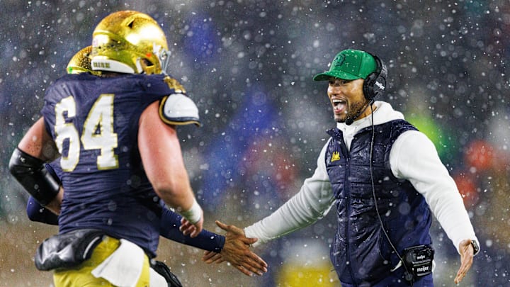 Notre Dame head coach Marcus Freeman, right, celebrates after a touchdown during the second half of a NCAA football game against Navy at Notre Dame Stadium on Saturday, Nov. 8, 2025, in South Bend.